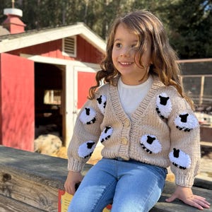 Handknit Toddler Buttercream Cardigan with Embroidered Sheep Pattern (12  in. h x 13 in. w)